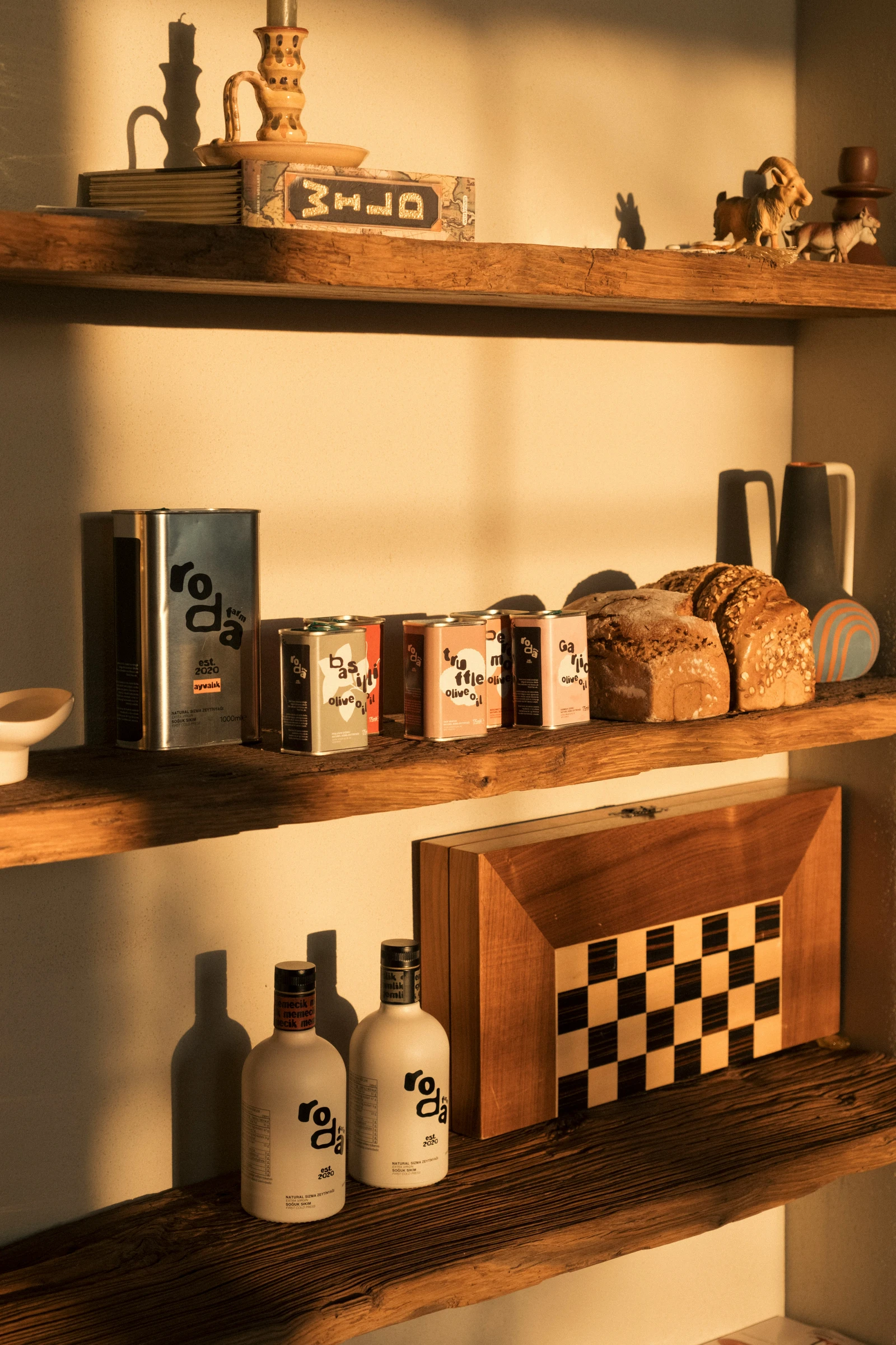 Artisan Mediterranean food products displayed on wooden shelves